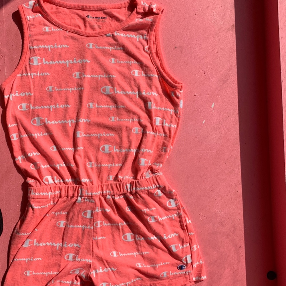 I will be selling a pink romper that has the word champion all over.